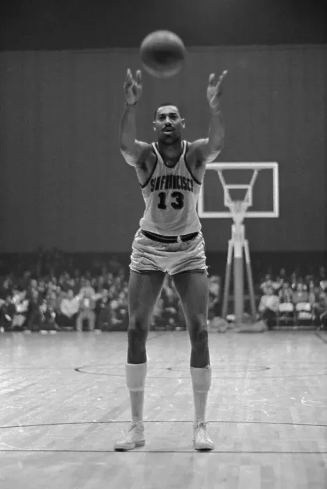 Framed Print : Wilt Chamberlain Tossing Basketball