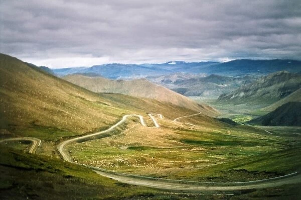 Winding mountain road in storm in Himalayas Tibet
