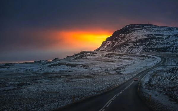 Winding road over sunset landscape of Iceland