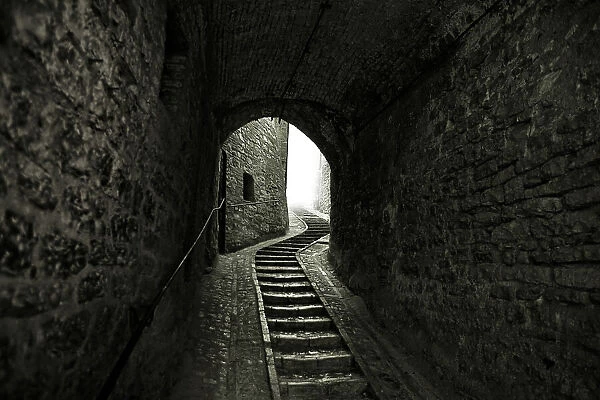 Winding Stone Staircase in Tunnel