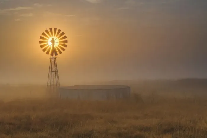 Framed Print : Windmill Backlit at Sunrise in the Mist and Fog of a Cold Winter Morning, Free State Province, South Africa