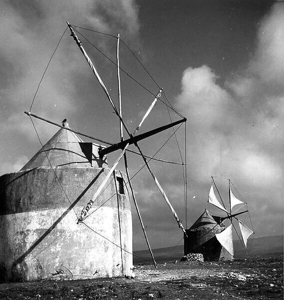 Windmills. circa 1950: Windmills on the hills above the Portuguese town of Tomar