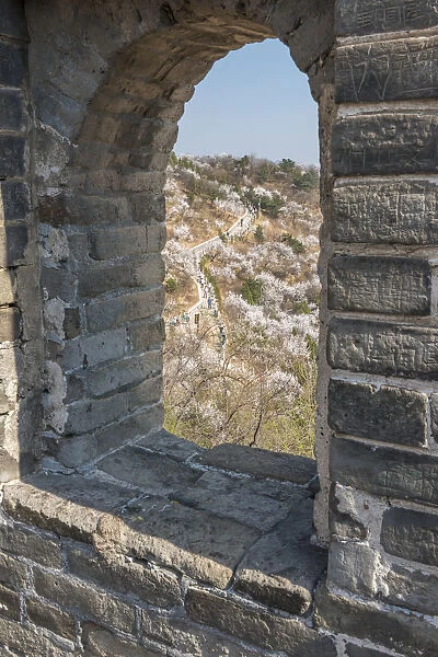 A window cut out over the Great Wall of China