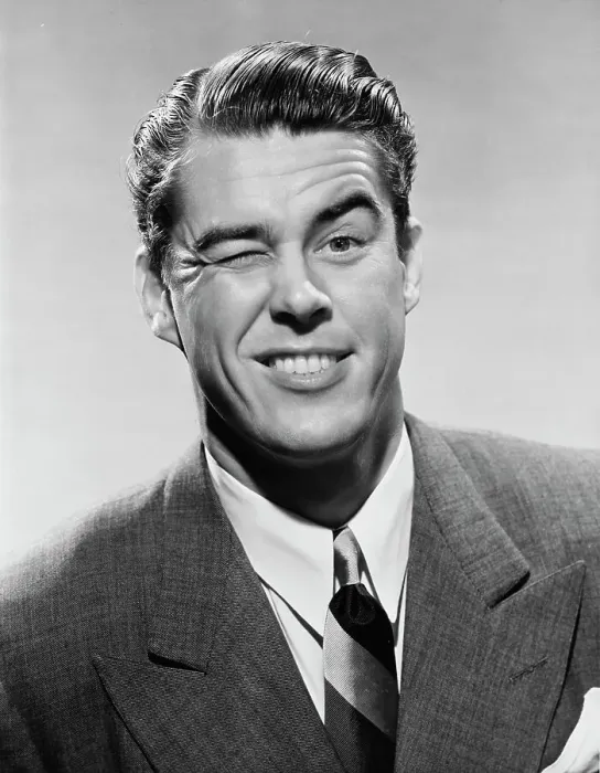 Framed Print : Wink Wink. A businessman winks dramatically, circa 1950
