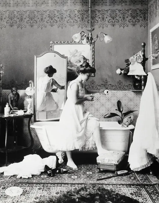Framed Print : Woman Adding Bath Salts To Bath Water Framed Print : Woman Adding Bath Salts To Bath Water
