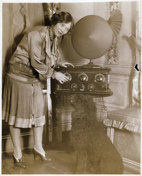 Framed Print : Woman Adjusting Dial On Early Radio Framed Print : Woman Adjusting Dial On Early Radio
