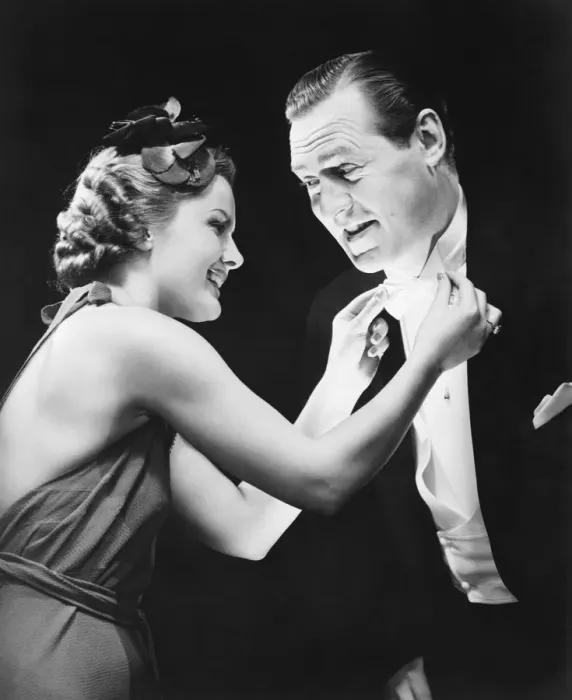 Framed Print : Woman adjusting mans bow tie (B&W) Framed Print : Woman adjusting mans bow tie (B&W)