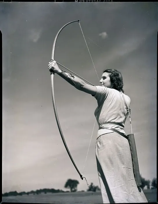 Framed Print : Woman Aiming Bow and Arrow Framed Print : Woman Aiming Bow and Arrow