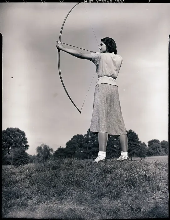 Framed Print : Woman Aiming Bow and Arrow Framed Print : Woman Aiming Bow and Arrow