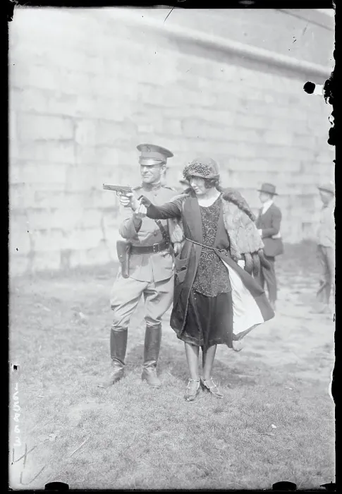 Framed Print : Woman Aiming a Gun Framed Print : Woman Aiming a Gun