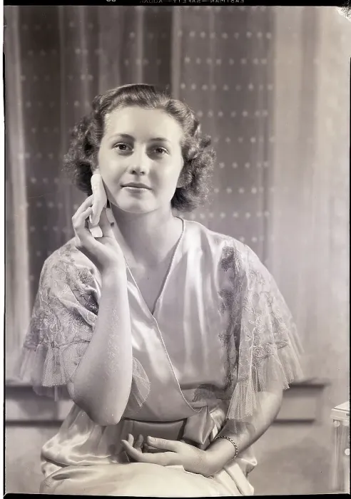 Framed Print : Woman Applying Face Powder Framed Print : Woman Applying Face Powder