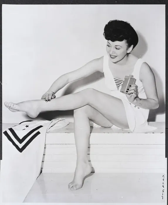 Framed Print : Woman Applying Stocking Makeup On Leg Framed Print : Woman Applying Stocking Makeup On Leg