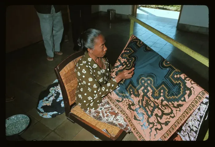 Framed Print : Woman Applying Wax to Fabric Framed Print : Woman Applying Wax to Fabric