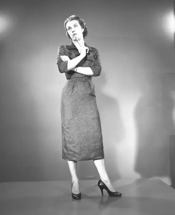 Framed Print : Woman with arms crossed in studio, (B&W) Framed Print : Woman with arms crossed in studio, (B&W)