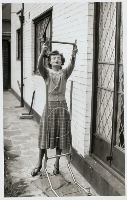 Framed Print : Woman Assembling a Ladder Framed Print : Woman Assembling a Ladder