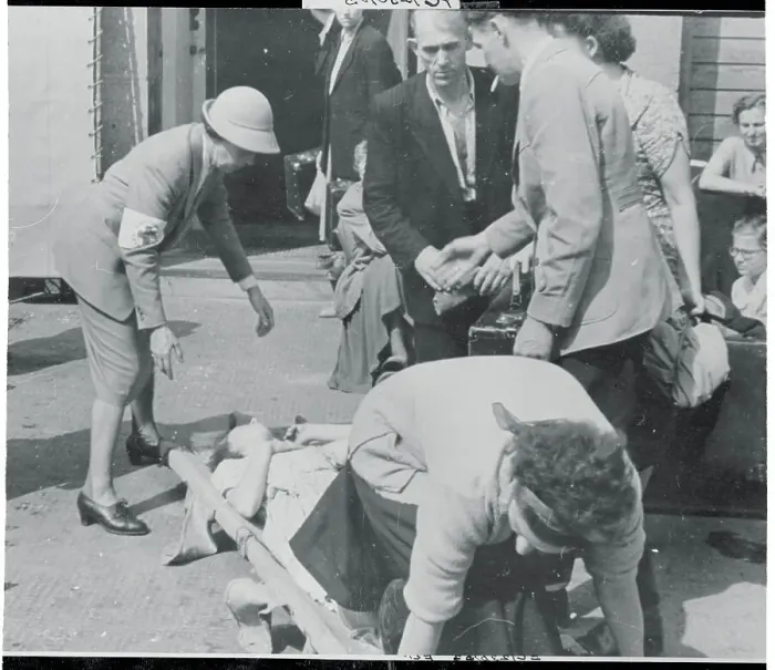 Framed Print : Woman Being Assisted by Medics Framed Print : Woman Being Assisted by Medics