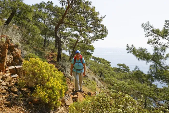 Framed Print : Woman with backpack hiking, Lycian Way, Lycian Coast, Olimpos Beydaglari National Park, Cirali, Lycia, Province of Antalya, Turkey