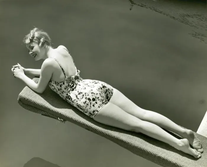 Framed Print : Woman in bathing suit lying on diving board Framed Print : Woman in bathing suit lying on diving board