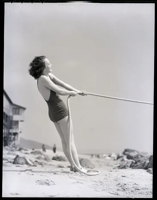 Framed Print : Woman in Bathing Suit Pulling Rope Framed Print : Woman in Bathing Suit Pulling Rope