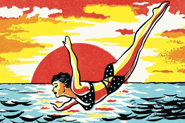 Woman in bikini diving