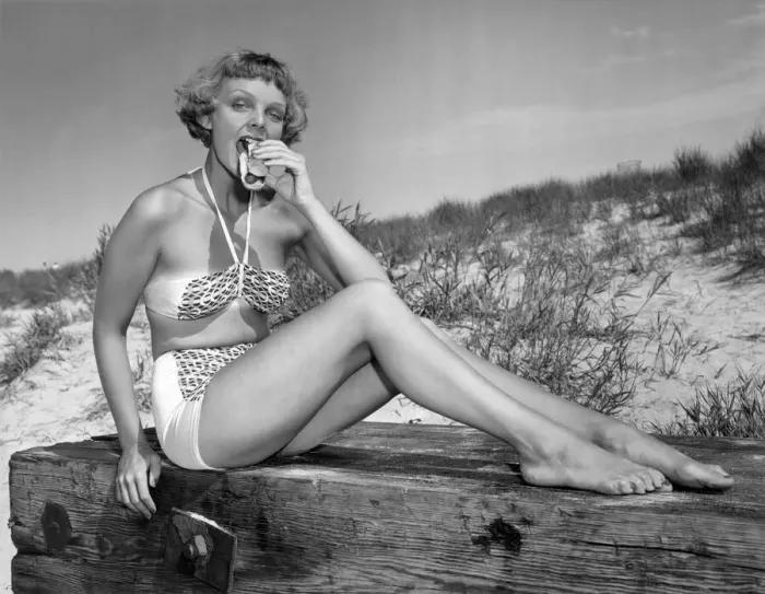 Framed Print : Woman in bikini, eating a hotdog Framed Print : Woman in bikini, eating a hotdog