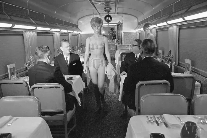 Framed Print : Woman in Bikini Walks Down Train Aisle Framed Print : Woman in Bikini Walks Down Train Aisle