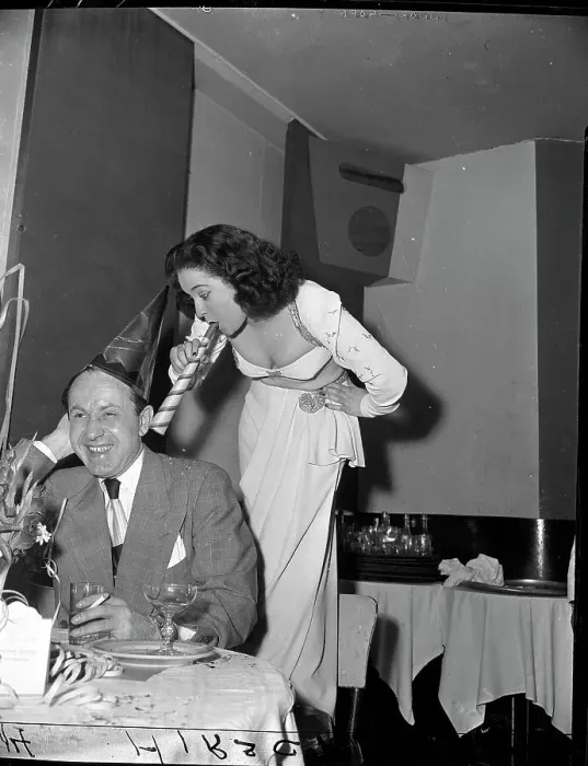 Framed Print : Woman Blowing Horn into Man's Ear Framed Print : Woman Blowing Horn into Man's Ear