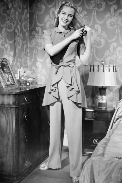 Framed Print : Woman brushing hair in bedroom, (B&W), portrait Framed Print : Woman brushing hair in bedroom, (B&W), portrait