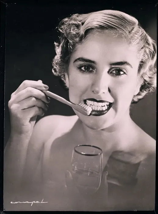 Framed Print : Woman Brushing Teeth Framed Print : Woman Brushing Teeth