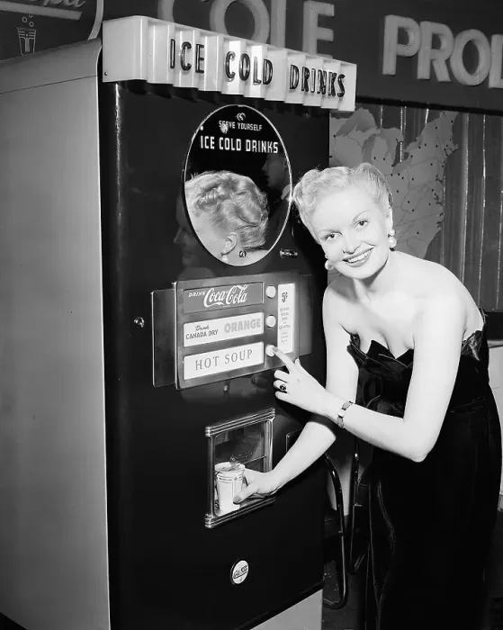 Framed Print : Woman Buying Soup from Vending Machine Framed Print : Woman Buying Soup from Vending Machine