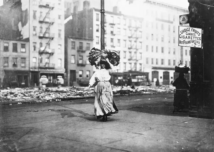 Framed Print : Woman Carrying Bundle Of Clothes On Head Framed Print : Woman Carrying Bundle Of Clothes On Head