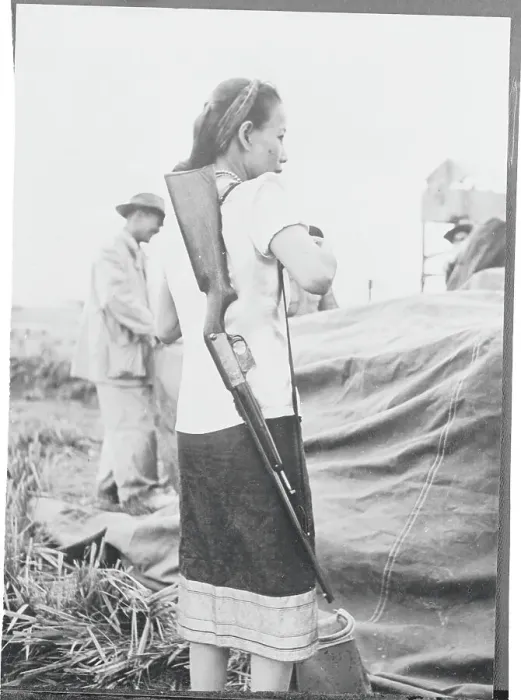 Framed Print : Woman Carrying Rifle on Shoulder Framed Print : Woman Carrying Rifle on Shoulder