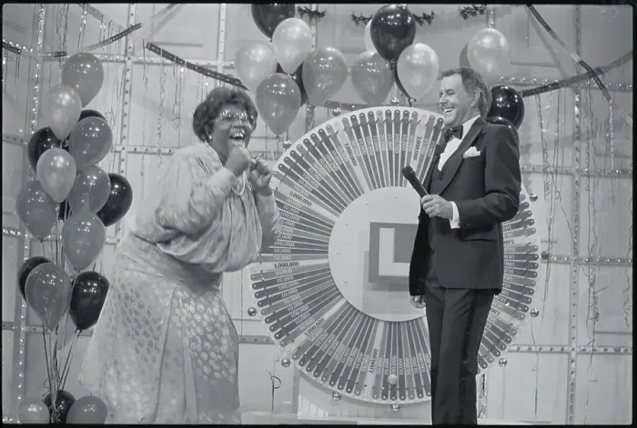 Framed Print : Woman Celebrating at Lottery Wheel Framed Print : Woman Celebrating at Lottery Wheel