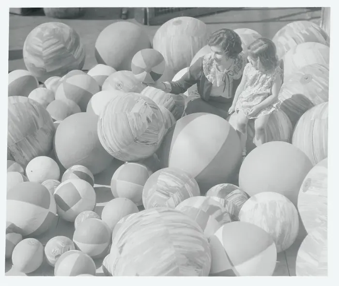 Framed Print : Woman and Child Observing Beach Balls Framed Print : Woman and Child Observing Beach Balls
