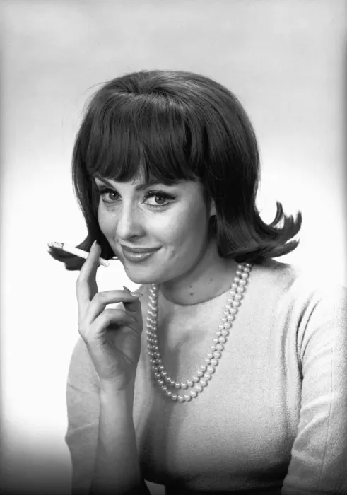 Framed Print : Woman with cigarette posing in studio, (B&W), portrait Framed Print : Woman with cigarette posing in studio, (B&W), portrait