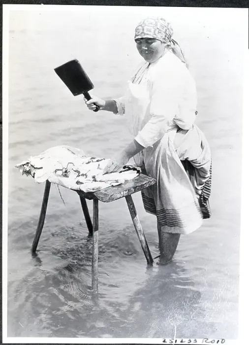Framed Print : Woman Cleaning Clothes in River Framed Print : Woman Cleaning Clothes in River