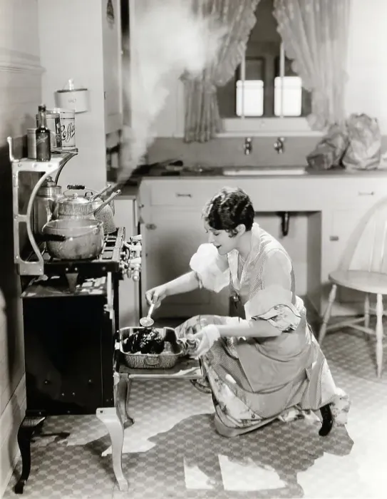 Framed Print : Woman Cooking In Kitchen At Stove Framed Print : Woman Cooking In Kitchen At Stove