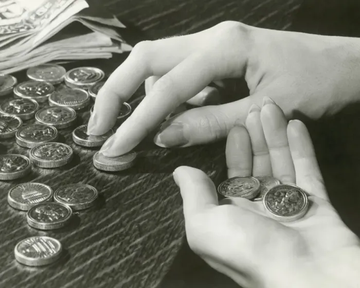 Framed Print : Woman counting change, close up of hands Framed Print : Woman counting change, close up of hands