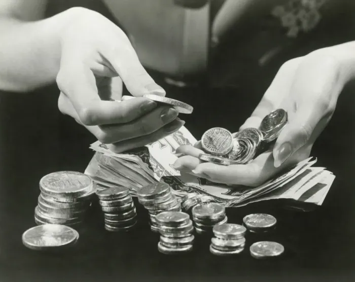 Framed Print : Woman counting change, close up of hands Framed Print : Woman counting change, close up of hands