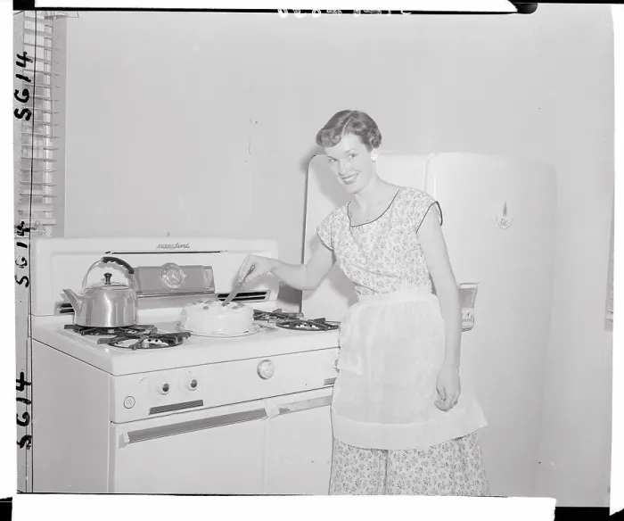 Framed Print : Woman Cutting a Cake Framed Print : Woman Cutting a Cake