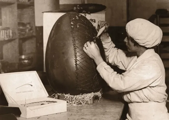 Framed Print : Woman Decorating Fifteen Pound Chocolate Easter egg (B&W sepia) Framed Print : Woman Decorating Fifteen Pound Chocolate Easter egg (B&W sepia)