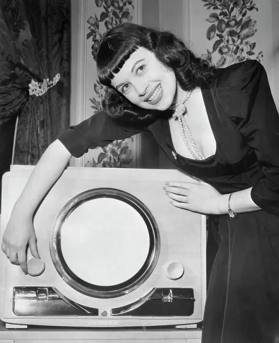 Framed Print : Woman Demonstrating New Television Framed Print : Woman Demonstrating New Television