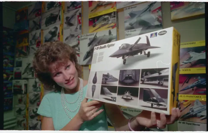 Framed Print : Woman Displaying Drawing of Super Secret Stealth Fighter Framed Print : Woman Displaying Drawing of Super Secret Stealth Fighter