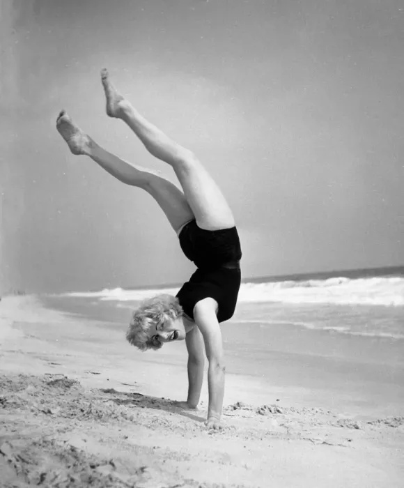 Framed Print : Woman does handstand on the beach (B&W) Framed Print : Woman does handstand on the beach (B&W)