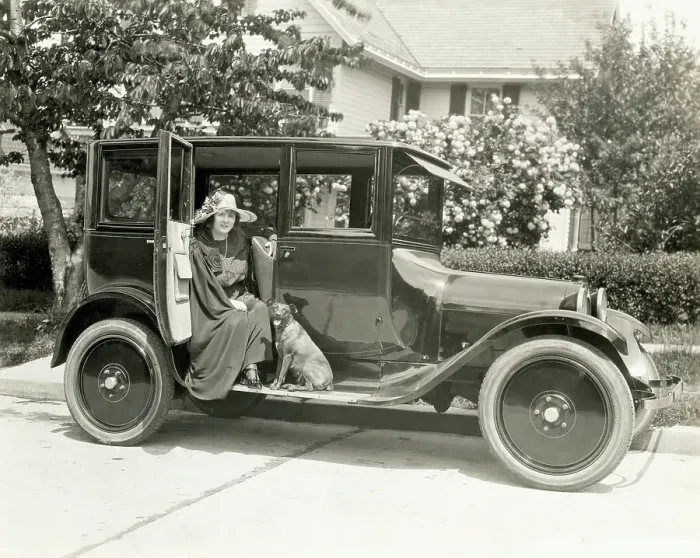 Framed Print : Woman And Dog Seated On A Dodge Outside Framed Print : Woman And Dog Seated On A Dodge Outside