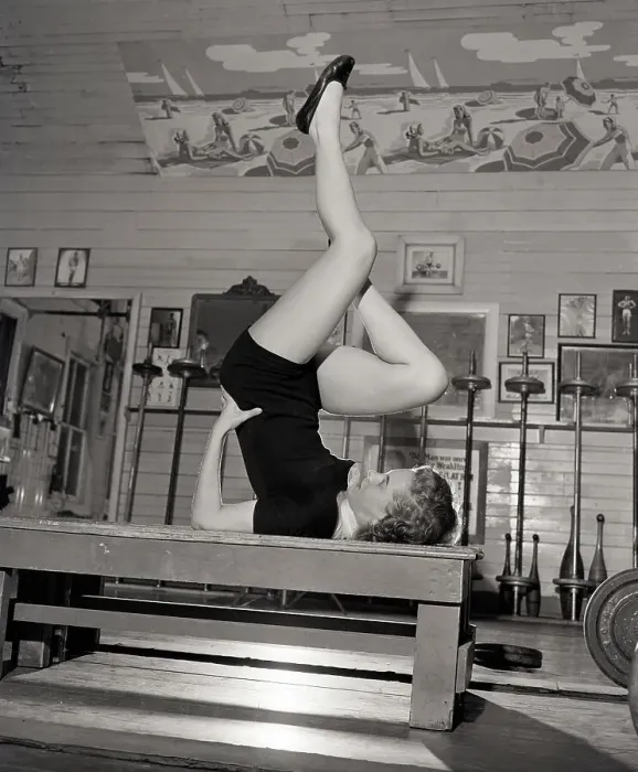Framed Print : Woman Doing Exercise With Legs In Air