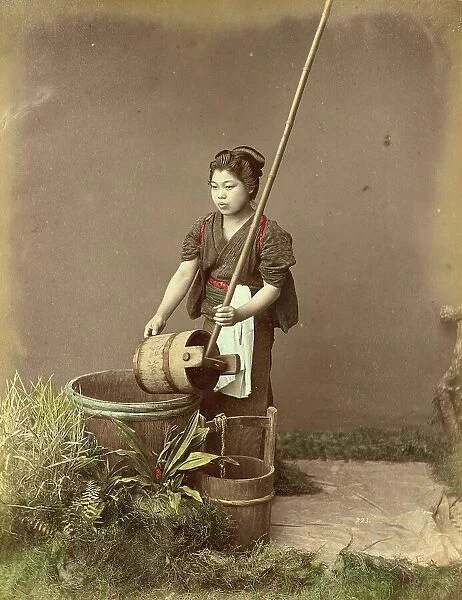 Woman drawing water from a well, c. 1870, Japan, Historic, digitally restored reproduction from an original of the period