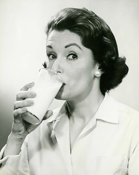 Woman drinking milk, (B&W), (Portrait)