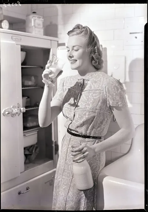 Framed Print : Woman Drinking Milk Next to the Refrigerator Framed Print : Woman Drinking Milk Next to the Refrigerator