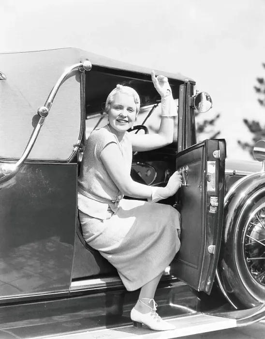 Framed Print : Woman in driver's seat of car, with door open, leaning out to wave Framed Print : Woman in driver's seat of car, with door open, leaning out to wave